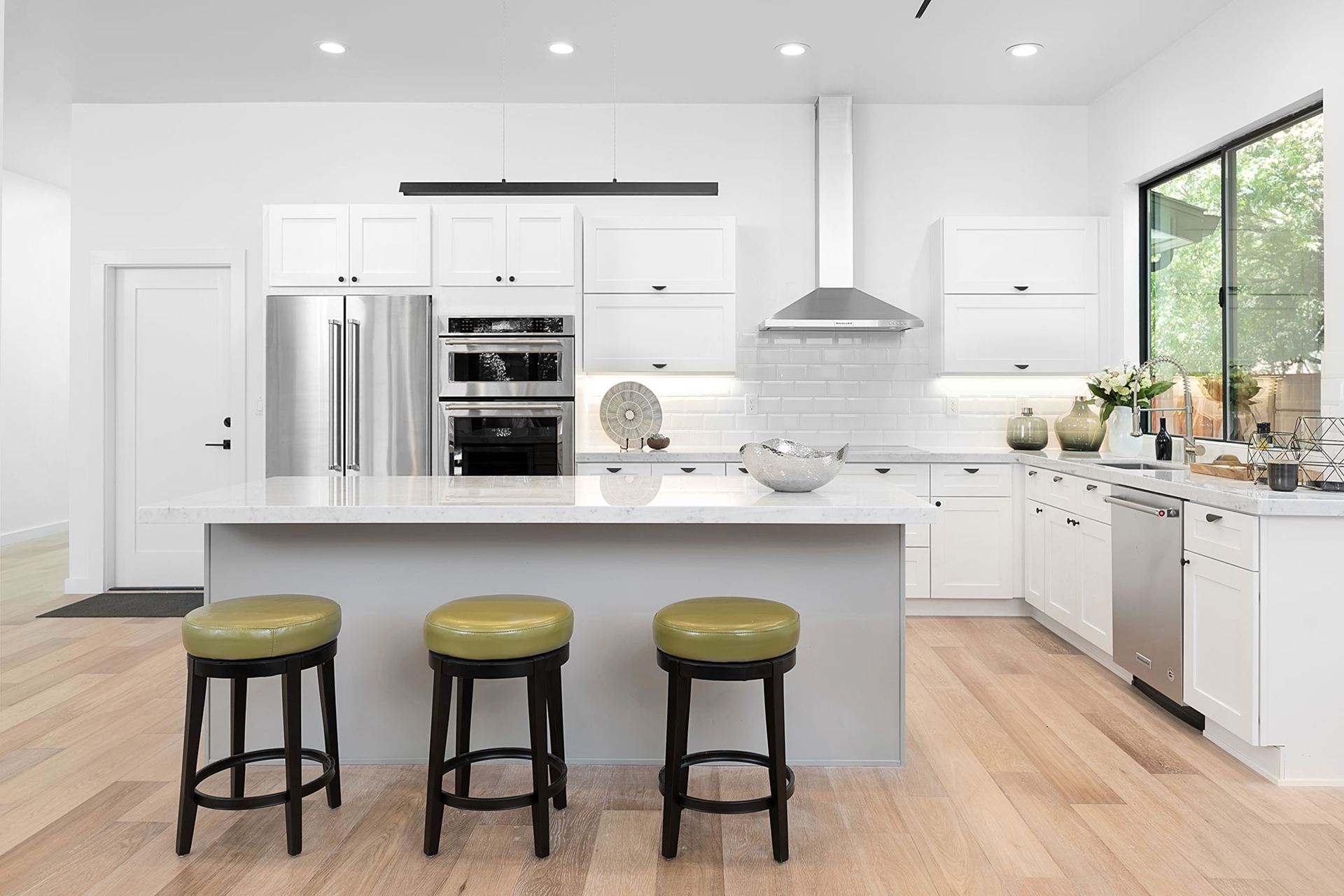 White modern kitchen with island seating