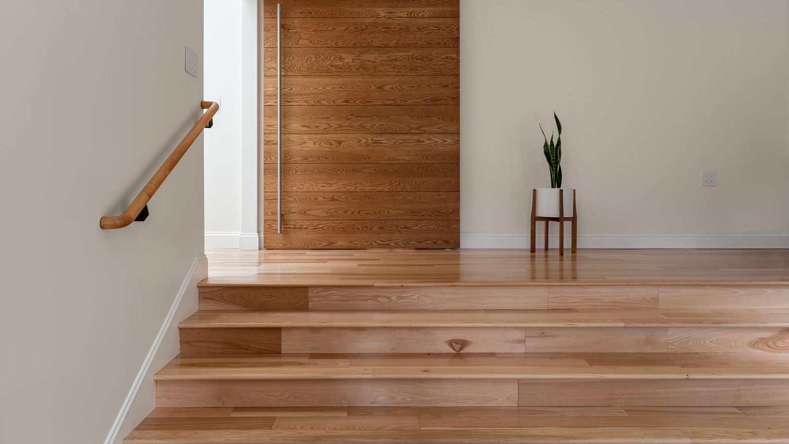Wood pivot door and oak stairs in the Castro Valley project