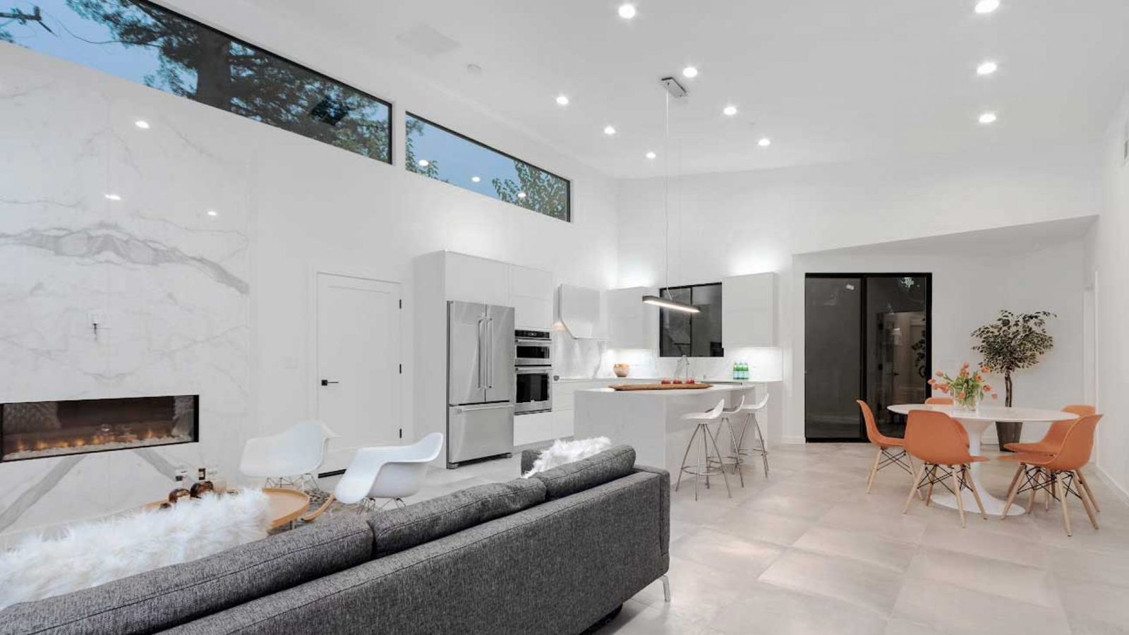 Open living room with modern fireplace and clerestory windows